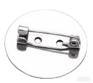 Small metal badge pin shown separately